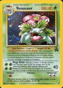Venusaur — Wizards Black Star Promos · 13 · 2000 (Level 64, created for the Game Boy Color Trading Card Game. English copies came with the game's Official Nintendo Player's Guide; the Japanese print, with a 'GB' symbol, came in the Pokémon Card GB Official Guidebook. The English card is holofoil all over, while the Japanese one only has a shiny sky.)